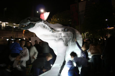 Sydney, Australia - June 4, 2011: Families interact with an Ice Bear Sculpture, a display by the World Wildlife Fund to highlight the plight of polar bears and the effects of climate change on their environmentのeditorial素材
