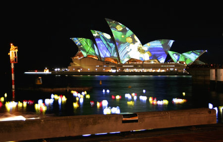 Sydney, Australia - June 12, 2009: Tourists watch as the Sydney Opera House Sails are lit up in brilliant colour for the Vivid Sydney Festivalのeditorial素材