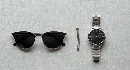 Wristwatch and sunglasses on a white background. Fashion concept.の写真素材