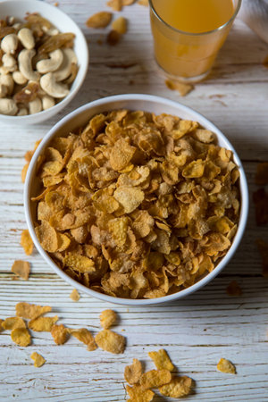 Healthy food dry corn flakes in a bowl with use of selective focus.