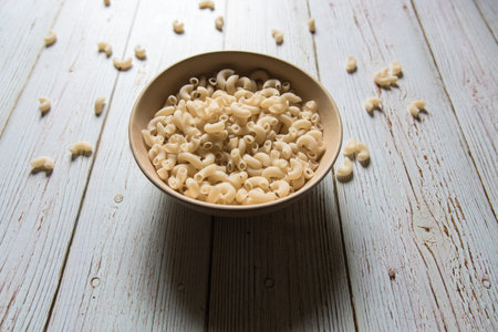 Close up of macaroni pasta in a bowl with use of selective focus.の写真素材