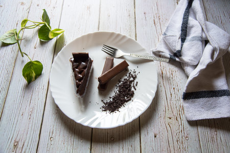 Popular dessert ingredients chocolate cake, chocolate chips and chocolate on a plateの写真素材