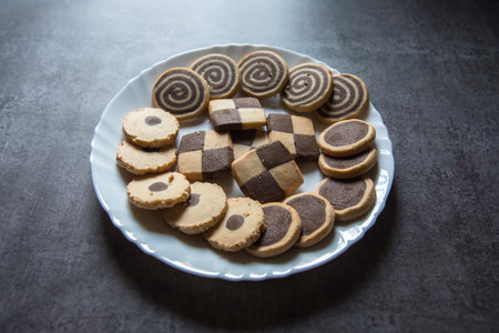 Close up of variety of chip cookies on a white plate on a background.の写真素材
