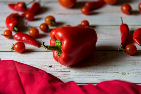 Close up of red bell pepper on a wooden background with use of selective focus.の写真素材