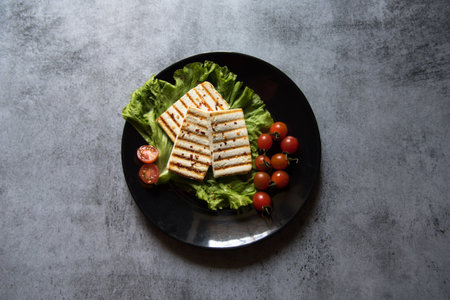 Grilled paneer or cottage cheese on a plate. View from top, selective focus.の写真素材