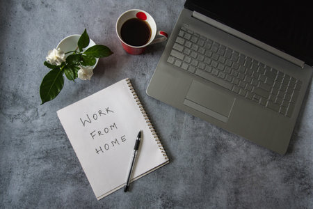 Work from home handwritten with use of selective focus . Work from home is the new normal concept in...