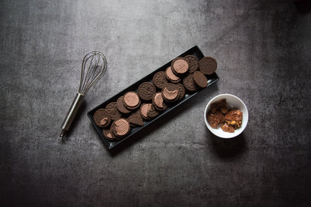 Cookies on a black tray with use of selective focus. Top view.の写真素材