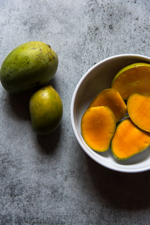 Himsagar or sweet mango, a favourite fruit across India, generally found from the onset of summer till the monsoons. Close up. Food photography background.の写真素材