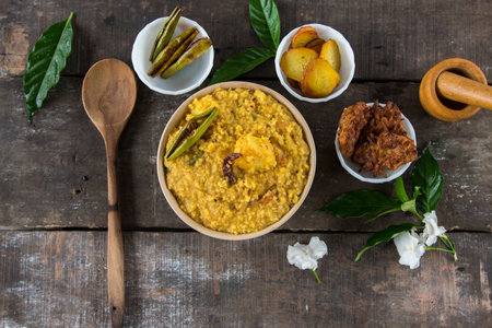 Khichdi or Khichadi, a popular Indian recipe. The food is made of dal or lentils and rice combined with Indian spices and tomatoes. Top view.の写真素材