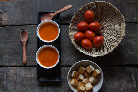 Ready to eat fresh tomato soup served in bowls. Top view.の写真素材
