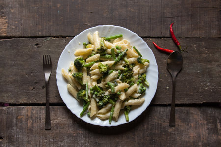 Italian delicacy penne pasta in cheese sauce in a plate. Top view.の写真素材
