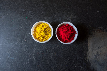 Gulal or holi festival colors on a dark background.の写真素材