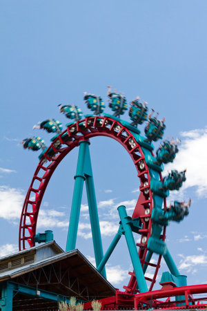 A roller coaster in Denver Colorado flips people upside down for a thrilling ride の写真素材