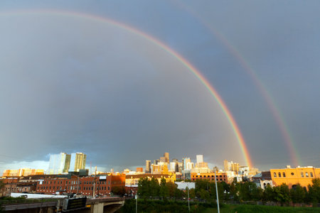 Double rainbow over the downtown Denver Colorado Skylineのeditorial素材