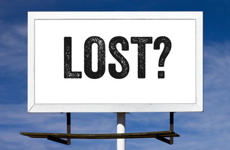 Lost? message painted on a billboard signの写真素材