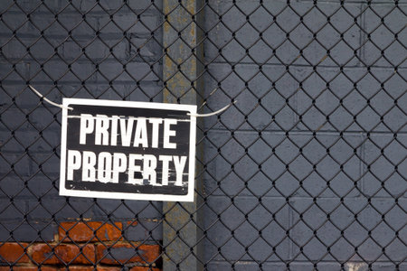 Private property sign on old fence in New York Cityの写真素材