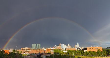 Double rainbow appears over the downtown Denver, Colorado skyline after a big thunderstormのeditorial素材