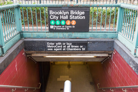 NEW YORK CITY â CIRCA 2016: The entrance to the Brooklyn Bridge City Hall subway station looks empty in the lower Manhattan area of New York City in 2016. The NYC subway system provides access to Manhattan, Queens, Brooklyn, the Bronx, and Staten Islandのeditorial素材