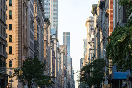 View down Fifth Avenue in Manhattan, New York City with historic buildings lining both sides of the street in NYCの写真素材