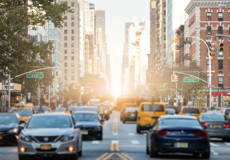 Traffic along 3rd Avenue in Manhattan New York City with Sunlight Background Glowの写真素材