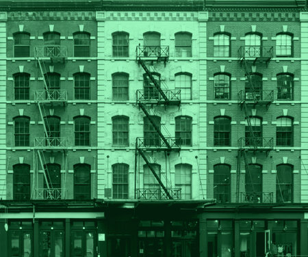Pink and blue wall of windows on New York City buildingsの写真素材
