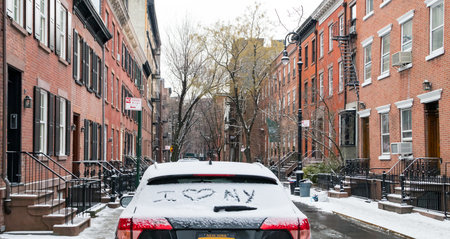 I love NY written in snow on a car parked in the Greenwich Village neighborhood of Manhattan after a winter stormのeditorial素材