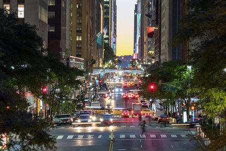 Colorful night lights of a busy scene on 42nd Street in Midtown Manhattan, New York City NYC