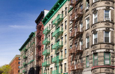 Colorful old historic buildings at the intersection of Mott and Kenmare Street in Nolita neighborhood of Manhattan, New York Cityの写真素材