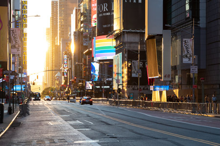 New York City, USA - June 14, 2020: Sunset light shines on the colorful signs and billboards at the...