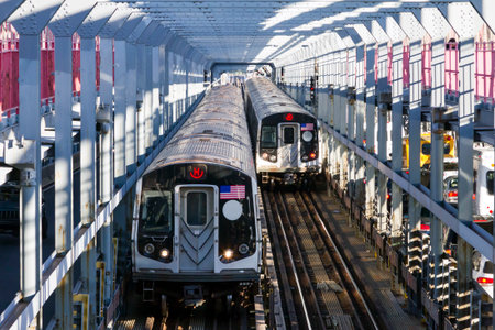 Subway cars crossing the Williamsburg Bridge from Brooklyn to Manhattan in New York Cityの写真素材