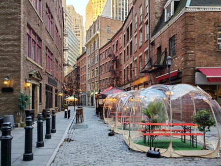 New York City, USA - November 26, 2020: Restaurants and bars enforce social distance safety with outdoor dining bubbles on Stone Street in Manhattanのeditorial素材