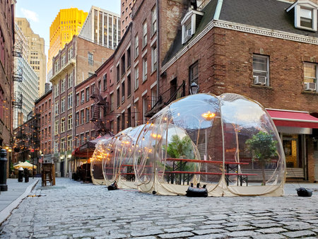 Outdoor dining tables in bubbles along Stone Street in downtown Manhattan, New York City NYCのeditorial素材