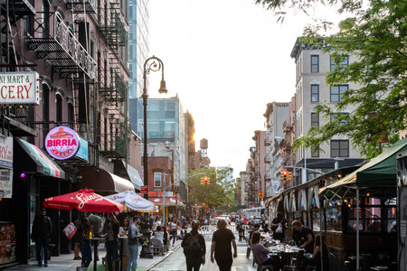 New York City - Busy scene with crowds of people at the outdoor bars and restaurants on Rivington Street in the Lower East Side neighborhood of Manhattan NYCのeditorial素材