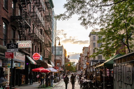 New York City - Crowds of people at the outdoor bars and restaurants on Rivington Street in the Lower East Side neighborhood of Manhattan NYCのeditorial素材