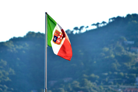 waving Italian flag with symbols of the 4 marine republics of Amalfi Pisa Genova Veneziaの写真素材