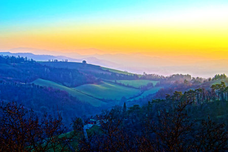 magical colors of a sunset on the hills, Italyの写真素材