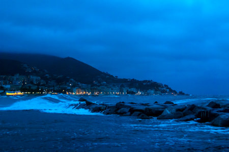 storm on the Mediterranean Sea, with high waves breaking violently against the cliffs, Varazze, Italyの写真素材