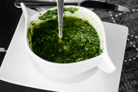 bowl of spicy herb sauce, called "bagnetto"の写真素材