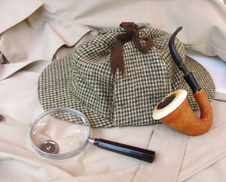 Tweed hat, calabash pipe, magnifying glass and trench coatの写真素材