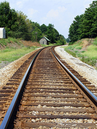 Train tracks curve into the distanceの写真素材