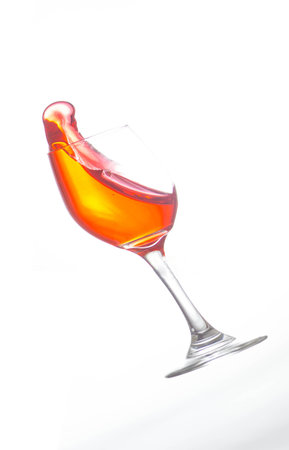 glass of wine tippingの写真素材