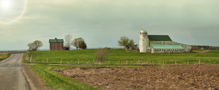 farm and farmhouse landscape at late dayの写真素材