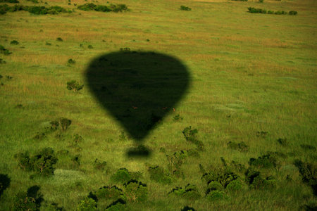 Shadow of hot air balloon over the Masai Maraの写真素材