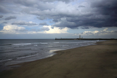 To Scarborough from Sandsend beach on a stormy dayの写真素材
