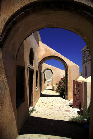 Greek archways against a blue sky in Santoriniの写真素材