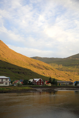 Village of Seydisfjordur east Iceland in the early morning sunの写真素材