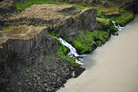 Basalt waterfall into the glacial Jokulsa a Fjollum river Icelandの写真素材