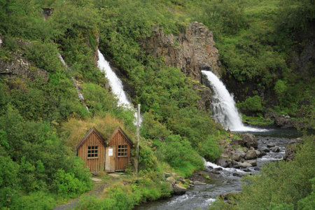 Little wooden house by the waterfall Skaftafell National Park Icelandの写真素材