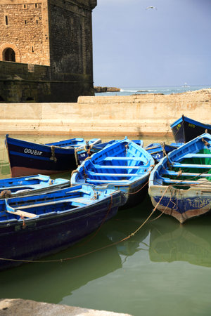 Blue fishing boats in Essaouira harbour Moroccoの写真素材