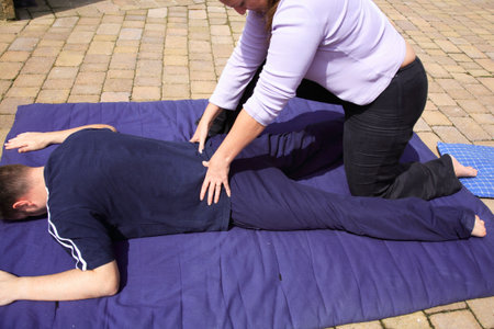 Lower back massage as part of a Thai body massageの写真素材